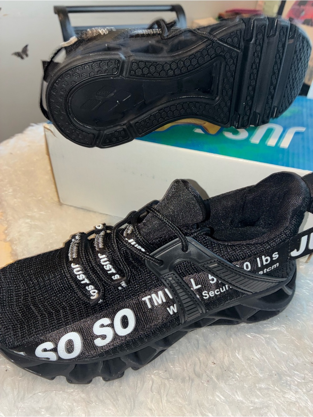 Black Athletic Sneakers with White Text Detail
